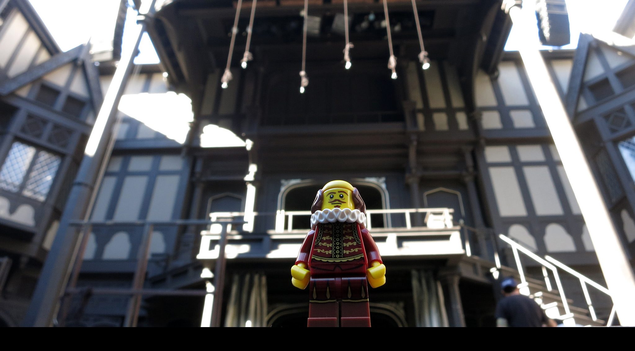 Lego Shakespeare standing in front of Lego Globe Theatre