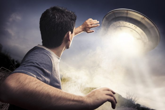 Man watching a UFO